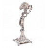 <p>Paliteiro em prata de lei contrastada representando indígena com pavão, contraste P coroa. 19 cm alt. Portugal Sec. XIX (No estado).</p> <p>Paliteiro em prata de lei contrastada representando indígena com pavão, contraste P coroa. 19 cm alt. Portugal Sec. XIX (No estado).</p>
