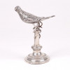 <p>Paliteiro em prata de lei representando pássaro, contraste - P.Coroa. Portugal Sec. XIX. 15 cm alt.</p> <p>Paliteiro em prata de lei representando pássaro, contraste - P.Coroa. Portugal Sec. XIX. 15 cm alt.</p>