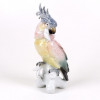 <p>Escultura de porcelana esmaltada representando Cacatua, manufatura Karl Ens de Volkstedt. Alemanha Sec XIX/XX - medindo 29 cm alt x 13 cm larg.</p> <p>Escultura de porcelana esmaltada representando Cacatua, manufatura Karl Ens de Volkstedt. Alemanha Sec XIX/XX - medindo 29 cm alt x 13 cm larg.</p>