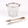 <p>Balde para gelo em cristal lapidado no Estilo bico de jaca, com borda em prata de lei 800 e alças laterais em motivos vegetais - 11 cm alt, 12 cm diâm.</p>