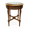 <p>Mesa auxiliar em madeira de lei, com apliques em bronze e tampo de mármore. 75 cm de alt.; 56 cm de diâm.</p> <p>Mesa auxiliar em madeira de lei, com apliques em bronze e tampo de mármore. 75 cm de alt.; 56 cm de diâm.</p>