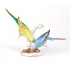 <p>Escultura em porcelana Hutschenreuther, representando &ldquo;Dois Periquitos/Calopsitas&rdquo;, desenhada pelo artista Karl Tutter. 22,5 cm de alt. x 33 cm de larg. (No estado).</p>