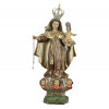 <p>Nossa Senhora do Carmo. Brasil, século XVIII. Nossa Senhora do Carmo. Imagem de madeira esculpida e policromada, com douração e esgrafitos, segurando Menino Jesus à esquerda, no hábito o símbolo da Ordem do Carmo, olhos de vidro, cabelos cobertos por manto curto, pés calçados, sobre nuvens com rosto de três anjos e base quadrada com os cantos chanfrados; 64 cm de altura total e 56 cm de altura sem a coroa. Acompanham duas coroas e um escapulário. Origem: espólio de Edgar Clat Gaspar.</p>