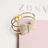 Bracelete Arco laço Dourado com Strass