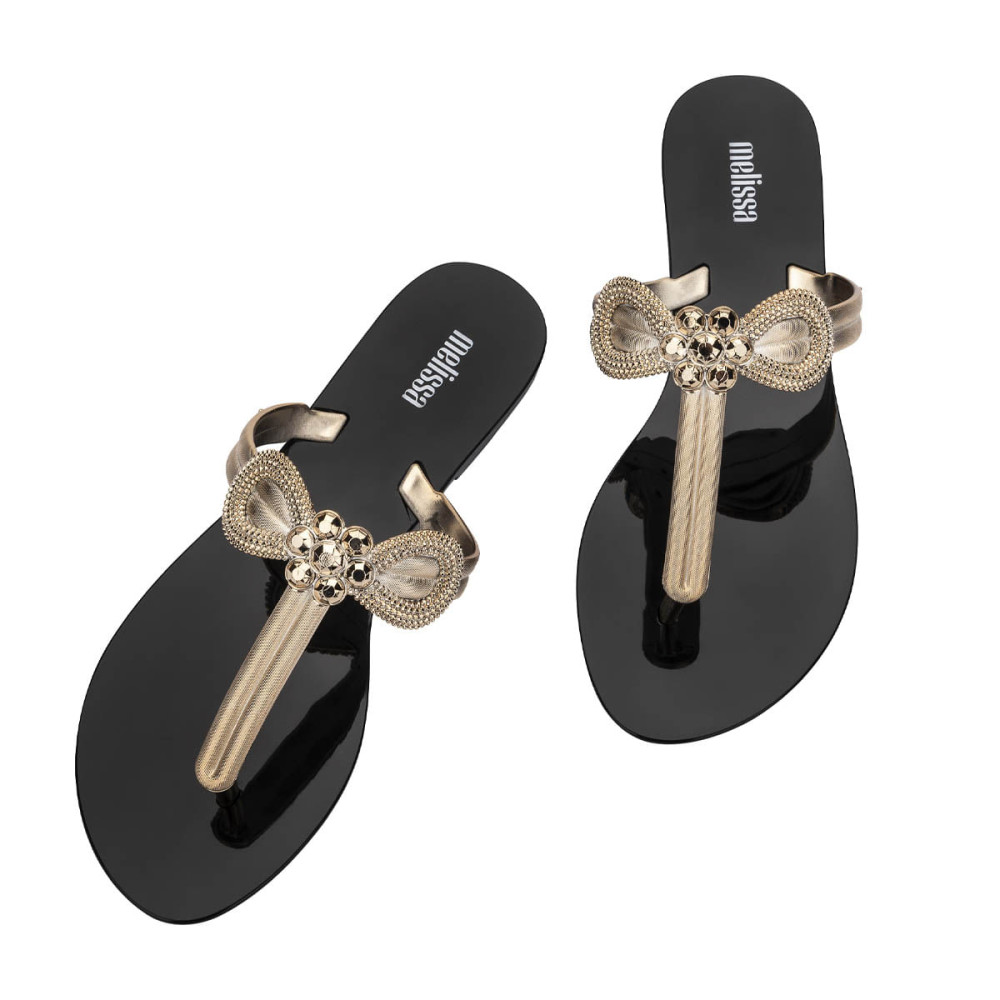 MELISSA HARMONIC T BAR GLEAM AD