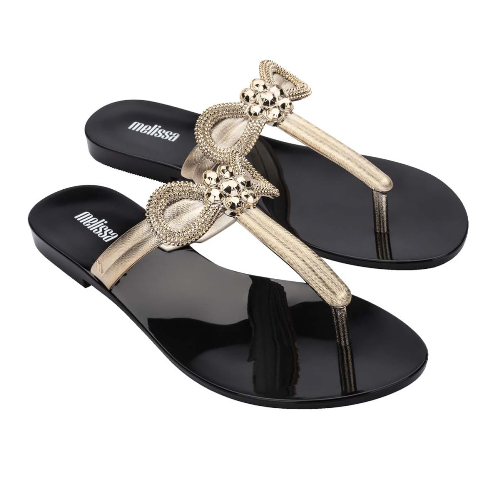 MELISSA HARMONIC T BAR GLEAM AD