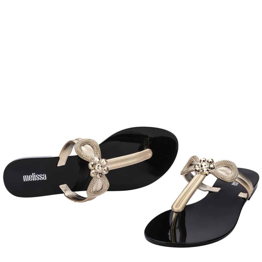 MELISSA HARMONIC T BAR GLEAM AD