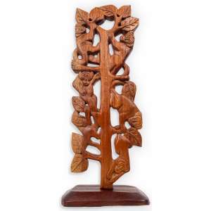 <b>VICENTINA JULIÃO - Árvore com Macacos</b><br><br>escultura em madeira entalhada, ass. no verso da base. 51 x 21 x 11 cm